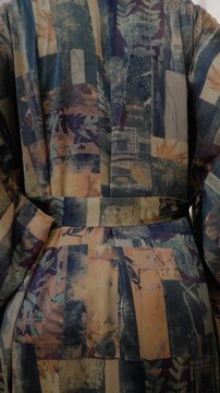 Close up of elegant woman wearing luxury kimono robe.