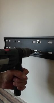 Screwing Wall Bracket with Power Drill and Wall Plugs | DIY | Vertical Video
