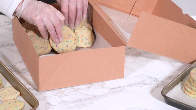 Packing Sprinkle-Adorned Sugar Cookies into Boxes