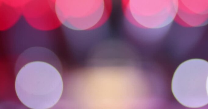 Abstract colorful bokeh light background with soft blur in red, purple, blue and white tones. Elegant festive backdrop for banners, presentations, advertising and creative design