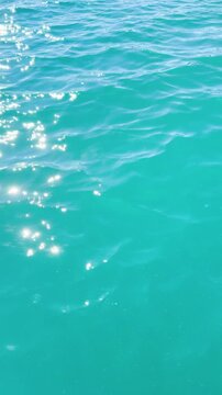 Turquoise ripple water reflection in tropical beach. Blue ocean waves. Summer sea. Waves in motion