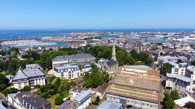 Saint-Servan, neighborhood of Saint-Malo, with Plage des Bas Sablons and walled city of Intra-Muros in background, Brittany, France. Aerial drone ascending