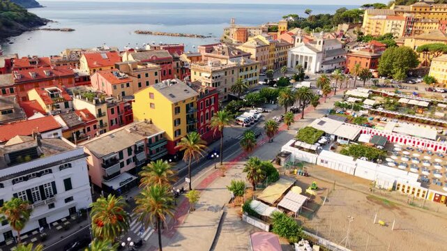 Aerial view over Sestri Levante waterfront, colorful buildings, and plaza by the sea
