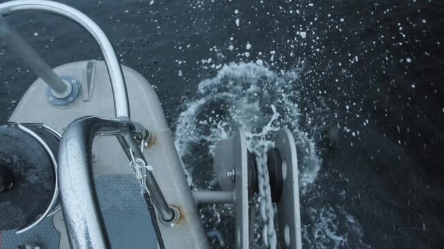 Yacht dropping anchor in sheltered Bay