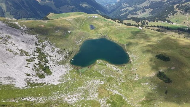 Drone view at the lake of Seefeldsee near Aelggialp geografic center of Switzerland on the Swiss alps