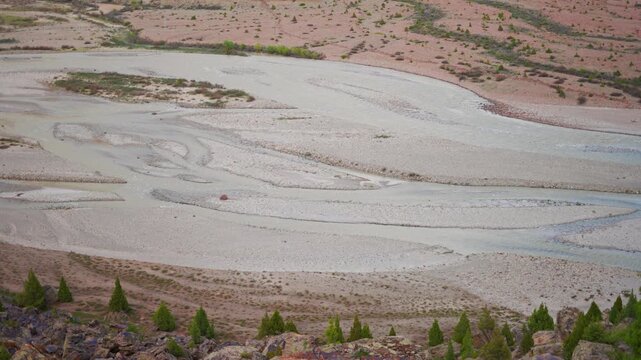4K Closeup shot of river bed of Bhaga River flowing during the summer season as seen from Darcha village in Lahaul and Spiti district, Himachal Pradesh, India. Scenic Himalayan mountain river.