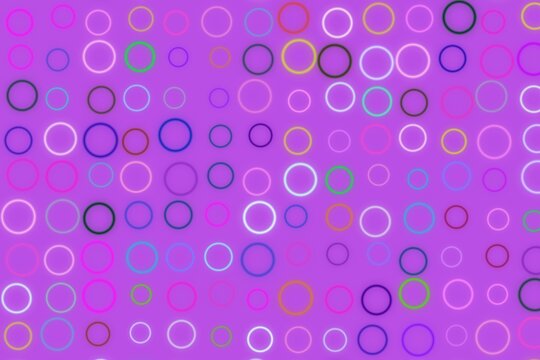 Colorful bokeh circles on purple background with glowing effect