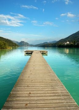 long wooden pier over the beautiful lake