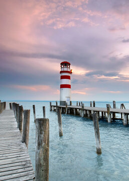 beautiful moments at the sunset near the lighthouse by the sea