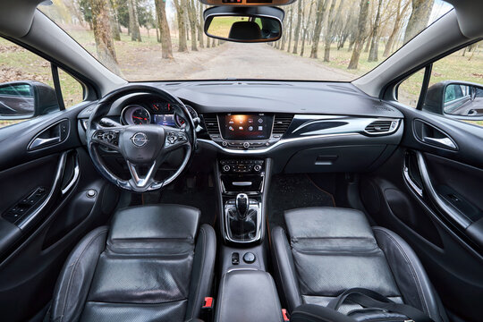 Berlin, Germany - April, 8 2026: Opel Astra K Sports Tourer wagon interior, leather seats, steering wheel, dashboard, multimedia screen, gear shift lever, central console, 5th generation car.