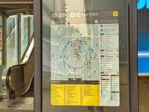 Jakarta, Indonesia - July 17, 2026: A public transport map and exit directory on an information board next to an escalator inside Blok M BCA MRT Station.