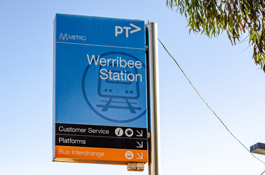 Public Transport Victoria (PTV) directional signage for Werribee Station, pointing toward platforms and the bus interchange&nbsp;in Melbourne, Victoria, Australia.