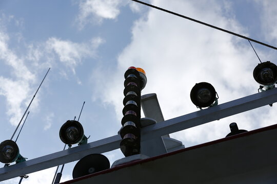 Marine Signal Lights Rise Above a Fishing Boat.
