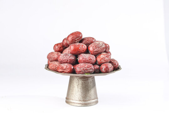Large Dried Ruoqiang Jujubes from Xinjiang China on Metallic Stand - Premium Asian Dates