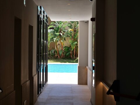 View from Indoor Corridor Toward Swimming Pool