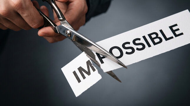 Scissors cutting the word "impossible" into two, symbolizing making the impossible possible and achieving goals.