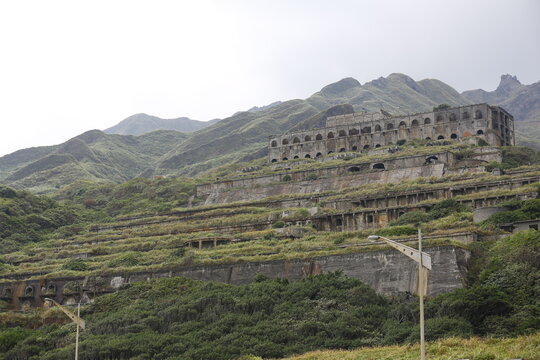Historic Shuinandong Smelter Ruins Rise Across a Mountainside.