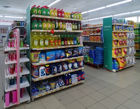 Supermarket aisle displaying cleaning products and supplies
