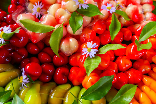Traditional Thai Mung Bean Marzipan Dessert Khanom Luk Chup Full Frame.Khanom Luk Chup, a traditional Thai dessert made from sweetened mung bean paste molded into glossy miniature fruits 