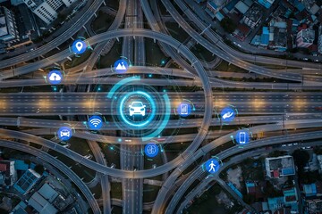 Fototapeta premium Aerial view of urban highway interchange with digital car interface and floating data