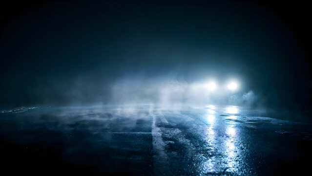 Car headlights on a dark foggy road at night. Vehicle driving through mist on wet asphalt.