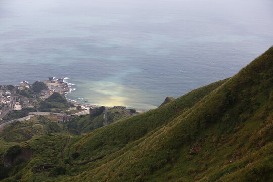 Green Hillside Overlooks Taiwan&rsquo;s Colorful Yin Yang Sea.
