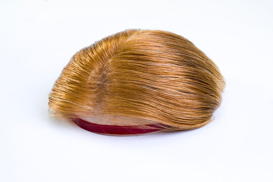 Golden wig on white background