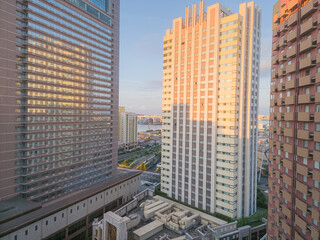 Naklejka premium Scenic morning view from a hotel window showing modern architecture and skyscrapers near Universal Studios in Osaka, Japan.