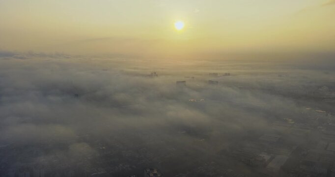 Aerial view of Saigon cityscape at morning with misty sky in Southern Vietnam. Urban development texture, transport infrastructure and green parks