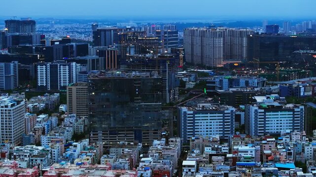 illuminated Corporate offices with Residential buildings, twilight and TCS Deccan Park at madhapur, hyderabad, telangana, india. evening time, trucking shot, drone shot, 4k.