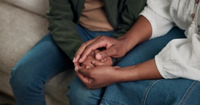 Mom, child and holding hands with love in home on sofa for bonding, understanding or listening. Mother, kid or empathy with son or comfort for sympathy, trust or emotional support together in house