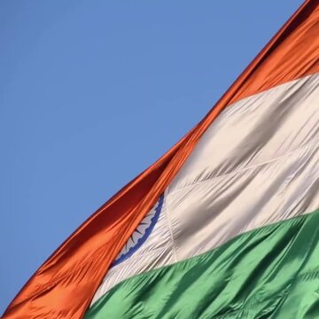 India flag flying high at Connaught Place with pride with plain white background, India flag fluttering, Indian Flag on Independence Day and Republic Day of India, tilt up shot, Har Ghar Tiranga