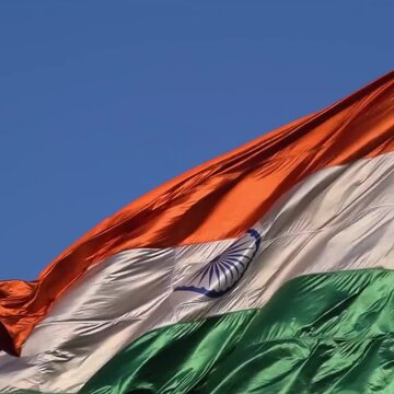 India flag flying high at Connaught Place with pride with plain white background, India flag fluttering, Indian Flag on Independence Day and Republic Day of India, tilt up shot, Har Ghar Tiranga