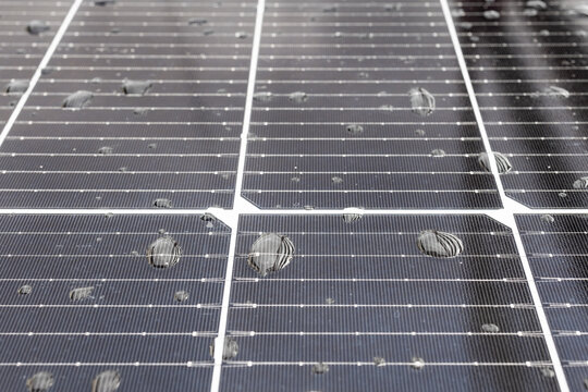 Improperly Angled Solar Panel is Poorly Drainage with  Water Droplets on Surface.