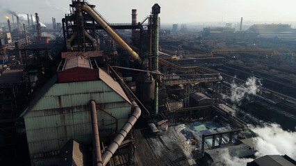 Fototapeta premium Factory, industrial enterprise, metallurgical plant, smoke from chimneys, aerial photography from a drone.