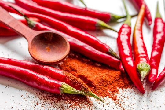 food ingredient red chilli pepper on white table background close up