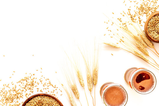 Beer background with barley on white background top view copy space