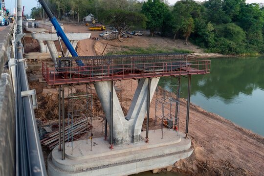 Bridge Pier Construction with Reinforced Steel Cage Installation at River Crossing Infrastructure Project