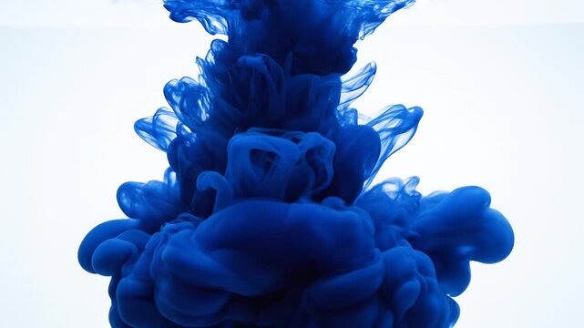 Blue Ink Cloud Expanding in Water Against White Background