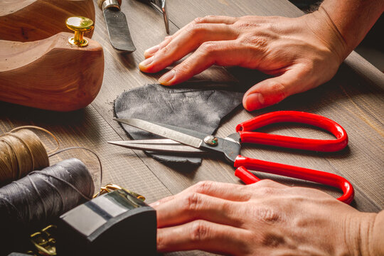 cobbler tools in workshop dark background close up