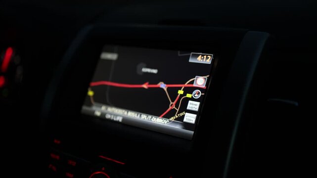 GPS navigation guides a driver along a highway route during a nighttime road trip with glowing map display helping follow directions toward a distant travel destination