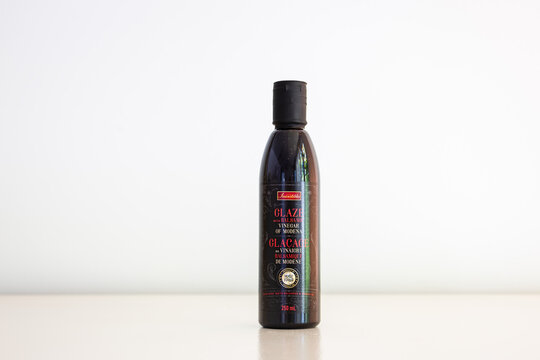 Quebec City, Quebec, Canada, August 3, 2026 - Small 250 ml bottle of Irresistible glaze with balsamic vinegar of Modena set on plain cream background