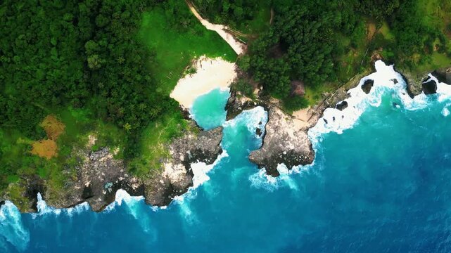 Turquoise waters framed by limestone cliffs at Mandorak Beach in Sumba Island, Indonesia