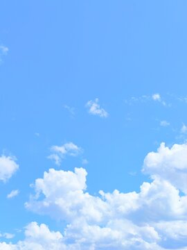 Blue sky and white clouds background beautiful nature day atmosphere clear sunny weather fluffy cloudscape wallpaper bright horizon aerial view for design.