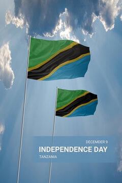Two flags of Tanzania in blue sky with clouds for National holiday