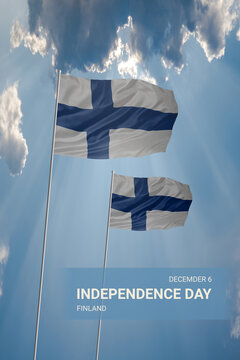 Two flags of Finland in blue sky with clouds for National holiday
