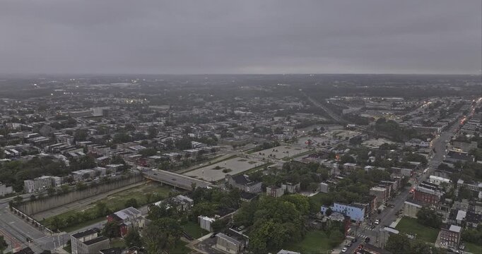 Baltimore Maryland Aerial v93 flyover above Harlem Park and Sowebo, revealing residential blocks and Franklin&ndash;Mulberry Expressway at dusk - Shot with Mavic 3 Pro Cine - Sept 28th 2023