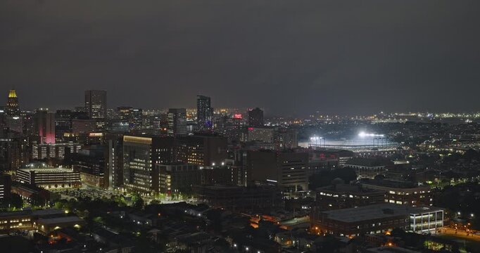 Baltimore Maryland Aerial v59 night flyover above Sowebo and the university hospital district, revealing the illuminated downtown skyline - Shot with Inspire 3 8k - Sept 28th 2023