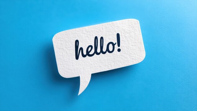 Minimalist white paper speech bubble with the word hello printed in black ink set against a flat cyan blue background greeting communication textured background dialogue minimalist