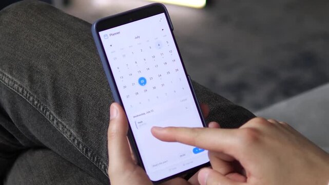 Mobile planner app for daily task management. User taps July 12th to review a Cook dinner reminder, then switches to July 22nd for a Walk event. Perfect for productivity software
